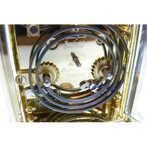 816 - A Matthew Norman gilt brass timepiece with striking movement, Swiss movement, with key