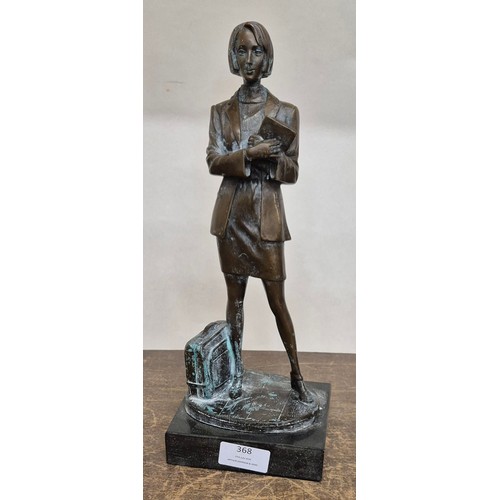 368 - A bronze figure of a female office worker on black marble socle