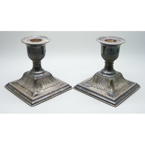 862 - A pair of silver dwarf candlesticks