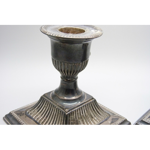 862 - A pair of silver dwarf candlesticks