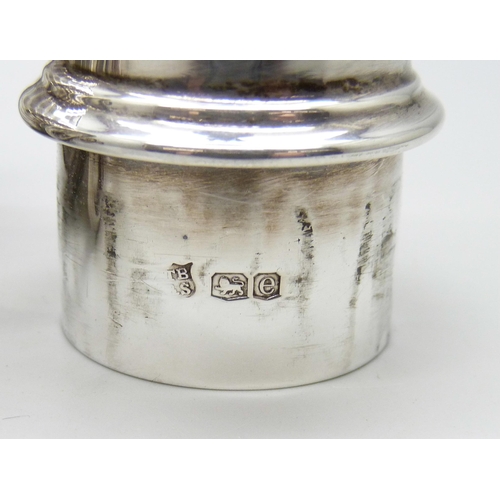 864 - A silver caster and a caster with continental control marks, 138g and 146g