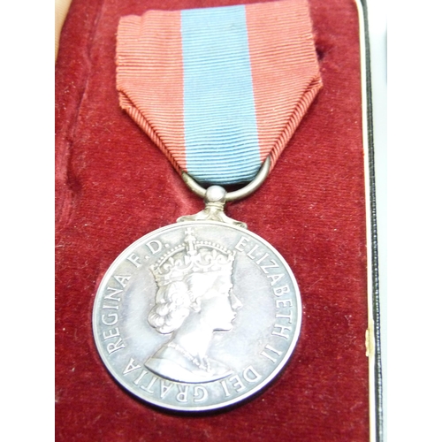 882 - Three medals, including a Queen Elizabeth II For Faithful Service medal to Harold Augustus Storr