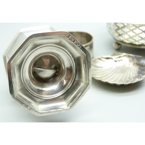 890 - A silver caster, Chester 1908, a pierced silver dish,  a silver napkin ring and a caddy spoon marked... 