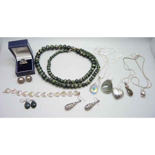 900 - A collection of silver jewellery, etc., including a hallmarked silver ring set with moss agate, size... 