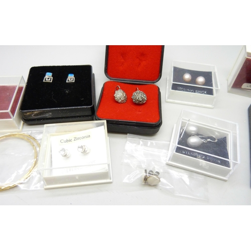 902 - Twelve pairs of silver earrings including pearl set