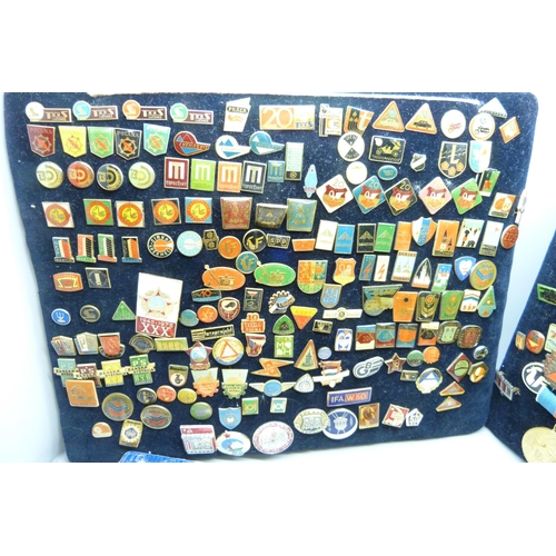 904 - A large collection of Eastern European badges and one boxed medallion