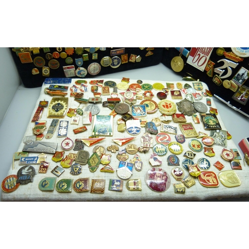 904 - A large collection of Eastern European badges and one boxed medallion