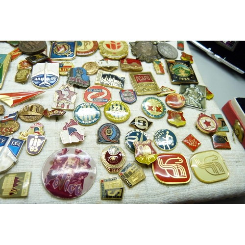 904 - A large collection of Eastern European badges and one boxed medallion