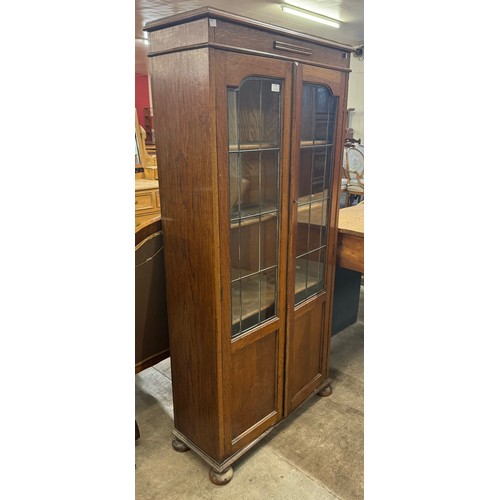 238 - An early 20th Century two door oak bookcase