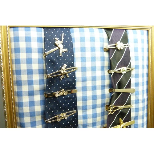 928 - A collection of novelty tie-clips, shirt studs and badges