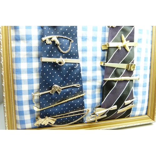 928 - A collection of novelty tie-clips, shirt studs and badges