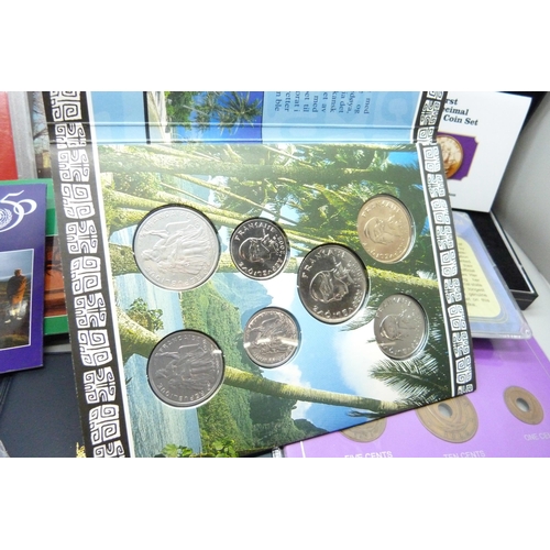 932 - Assorted coins, coin packs including Beatrix Potter 50p coin display