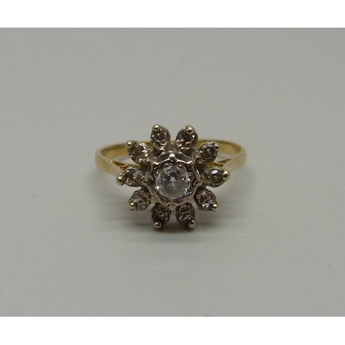 934 - An 18ct gold diamond cluster ring, 2.9g, N