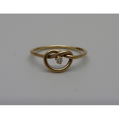 944 - A 9ct gold diamond set knot ring, 1.1g, N