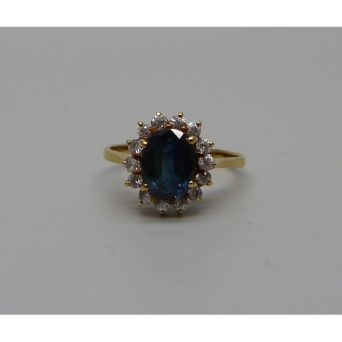 947 - A 14k gold sapphire and white stone cluster ring, 2.8g, M