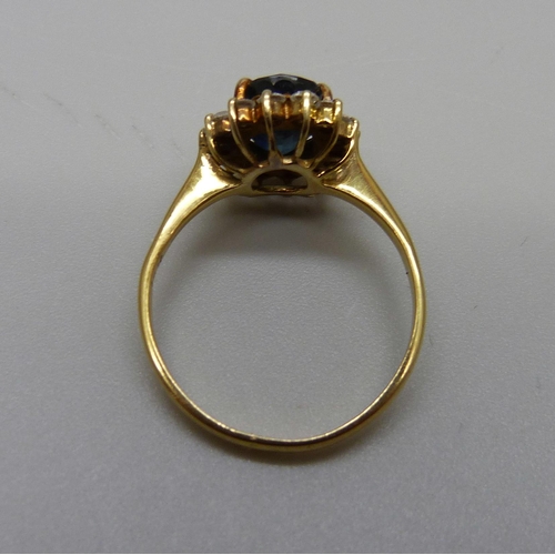 947 - A 14k gold sapphire and white stone cluster ring, 2.8g, M