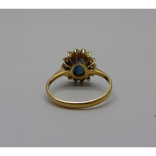 947 - A 14k gold sapphire and white stone cluster ring, 2.8g, M