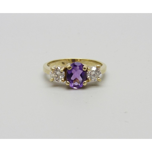 979 - An 18ct gold amethyst and diamond ring, approximately .90 carat diamond weight, 4g, Q