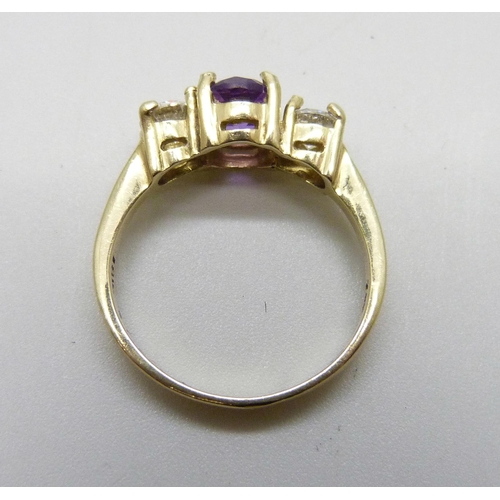 979 - An 18ct gold amethyst and diamond ring, approximately .90 carat diamond weight, 4g, Q