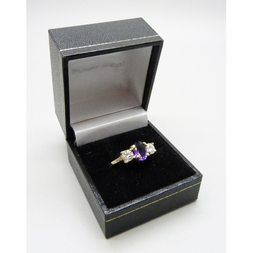 979 - An 18ct gold amethyst and diamond ring, approximately .90 carat diamond weight, 4g, Q