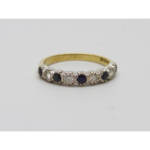 981 - An 18ct gold nine stone sapphire and diamond ring, 3g, O