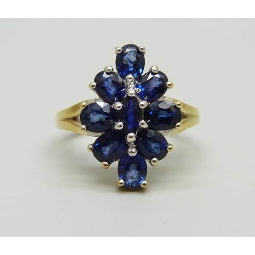 989 - A silver gilt blue stone set cocktail ring, R