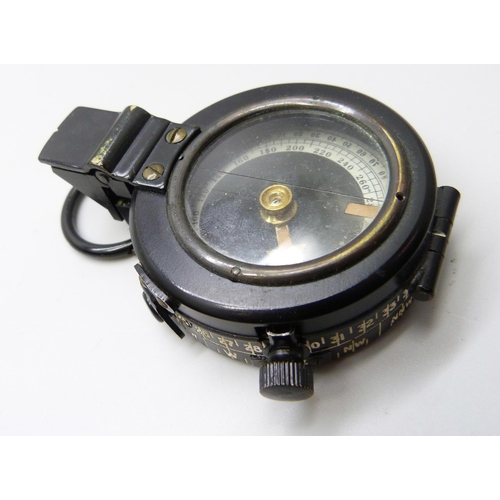 998 - A prismatic compass with leather case