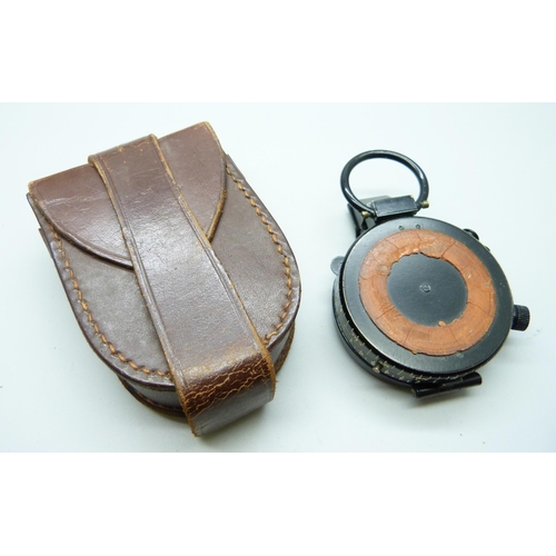 998 - A prismatic compass with leather case