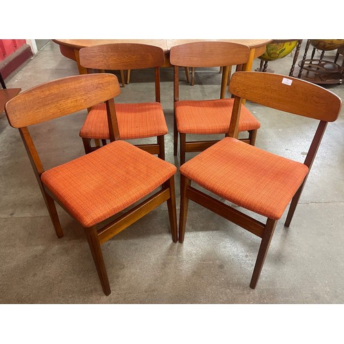 40A - A set of four teak dining chairs