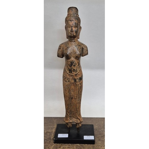 379 - A bronzed figure of a Tibetan deity, on faux marble socle