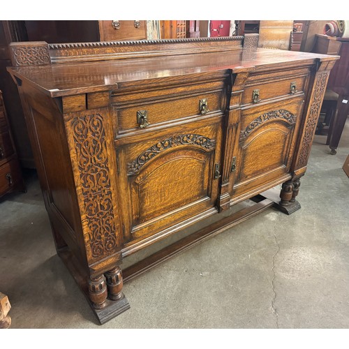 246 - An early 20th Century carved oak sideboard