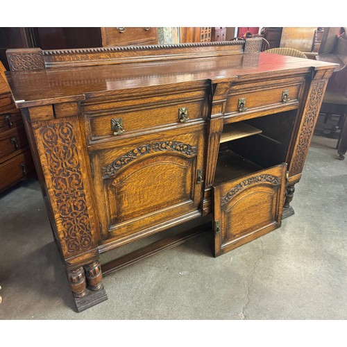 246 - An early 20th Century carved oak sideboard