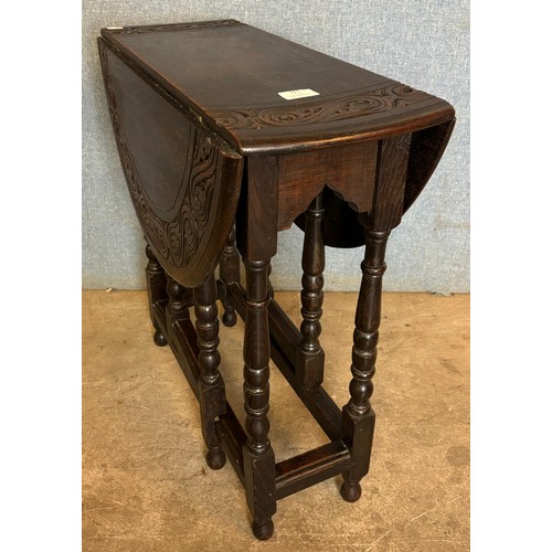 121 - A small 17th Century style carved oak gateleg table