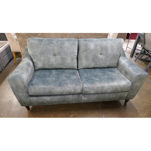 1423 - A teal velvet two and a half seater sofa