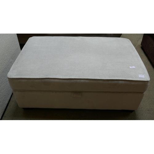 1557 - A large magnesium velvet footstool