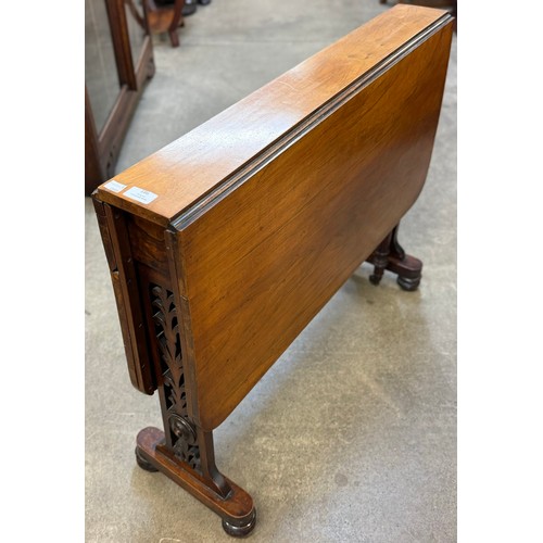 186 - A Victorian carved walnut Sutherland table