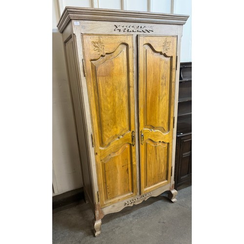 255 - An 18th Century style French carved fruitwood armoire