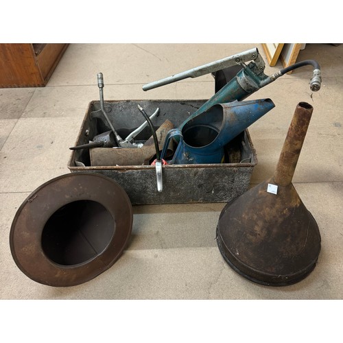 265 - An assortment of oil cans and funnels including a Rayes oil can