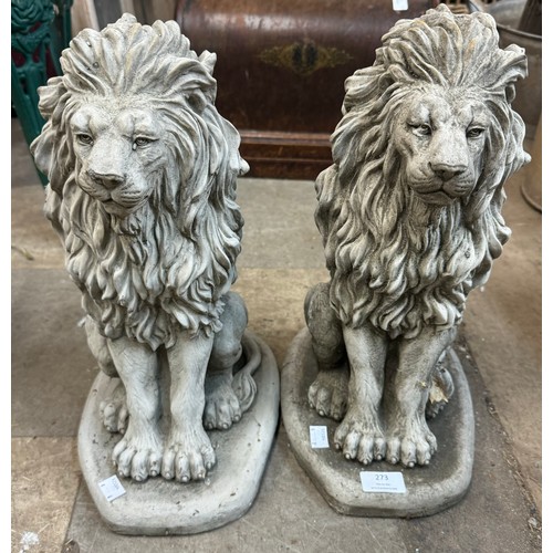 273 - A pair of concrete garden figures of seated lions