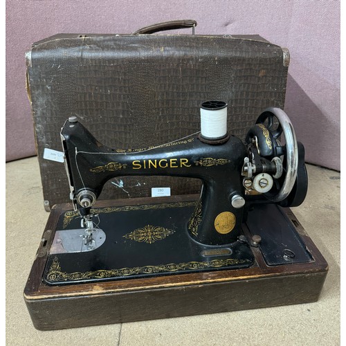 280 - A cased Singer sewing machine