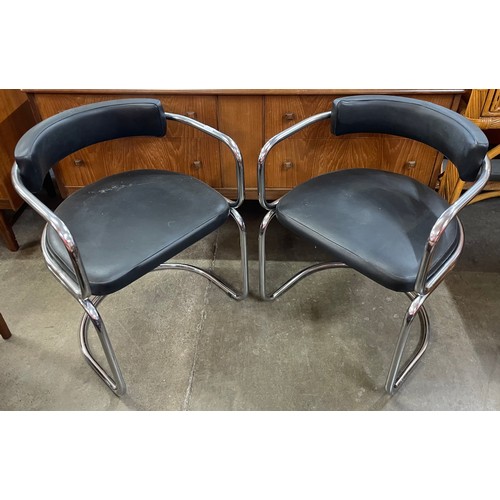 69 - A pair of chrome and black vinyl chairs