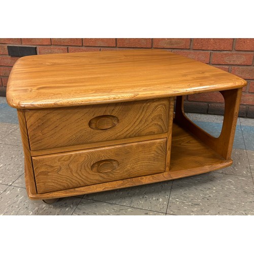 23E - An Ercol Blonde elm Pandoras Box coffee table