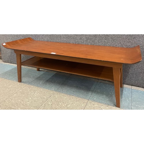 53 - A teak sleigh topped coffee table