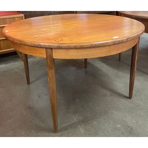 40 - A G-Plan Fresco teak circular extending dining table