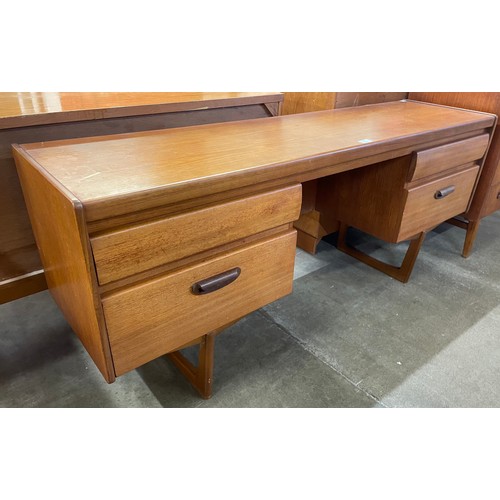 34 - A teak desk