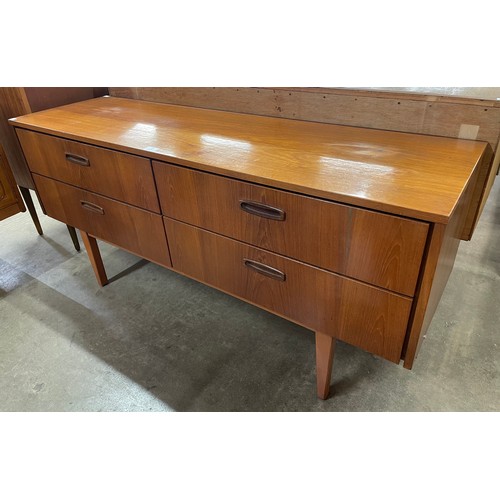 25 - A teak sideboard