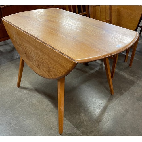 23 - An Ercol Blonde elm and beech Windsor drop leaf table