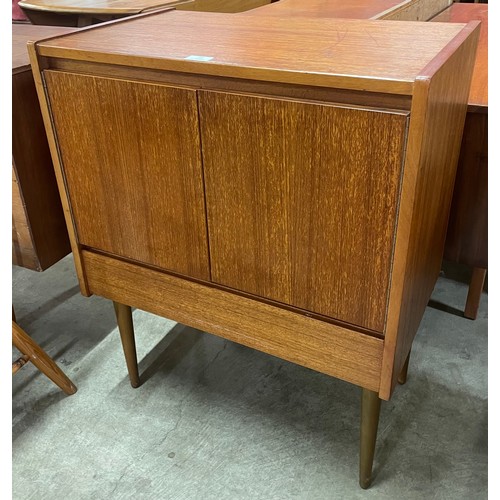 21 - A teak record cabinet