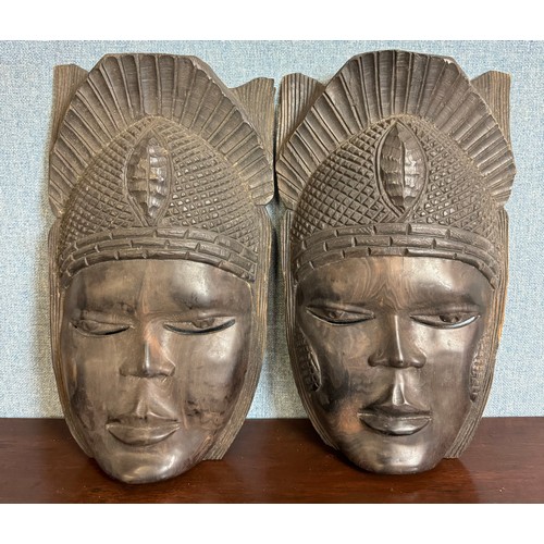 347 - Two Nigerian carved wooden wall masks