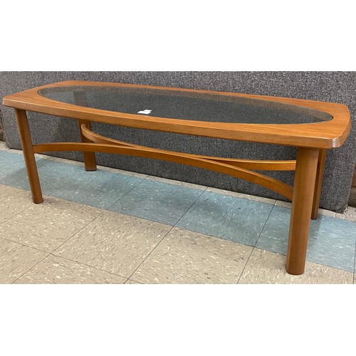 13 - A Nathan teak and glass topped coffee table